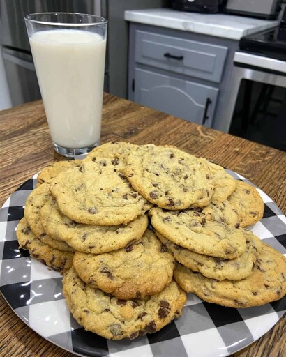 a plate of chockies with a glass of milk