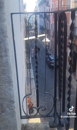 A photo of a balcony in Europe, where it’s metal work pattern is phallic